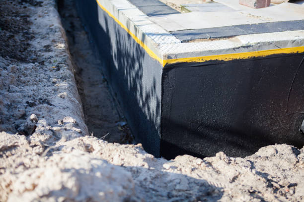 Professional Exterior Waterproofing technician working in Grand Blanc, MI